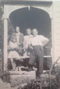 Alexander and family outside their home in Horitiu - Adams Family Collection.