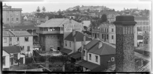 Looking east south east from the Banks Box Building in Wakefield Street showing Wakefield Street (diagonal far right), Langford Brothers, grocers (far right), Mrs E G Dawson boarding house on the corner of Lyndock Street (centre right), Globe Hotel (centre), Mount Eden (far right distance) - Sir George Grey Special Collections.